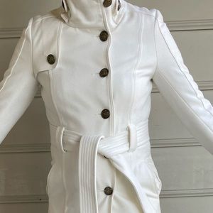 Beautiful white pea coat. Bronze color buttons and buckle detail on back.